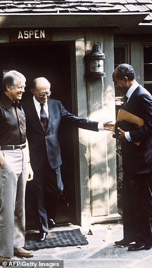 President Jimmy Carter, left, with Israeli Prime Minister Menachem Begin, middle, and Egyptian President Anwar Sadat, right, start peace talks between the two nations on September 6, 1978 at presidential retreat Camp David