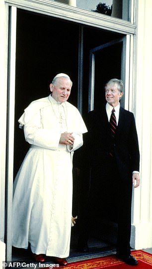 Pope John Paul II, left, with President Jimmy Carter, right, at the White House on October 6, 1979