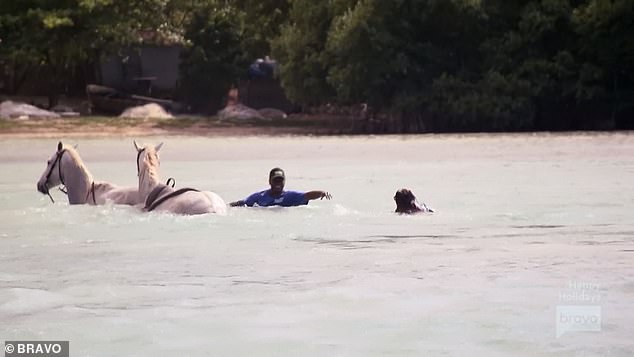 Dirty water: Jennifer, who'd never ridden a horse before, yelled 'my crotch is numb!' before falling off her steed into the poop-filled water