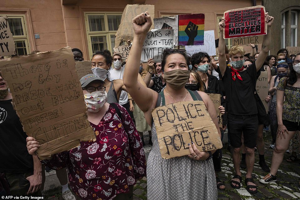 People protest against racism and pay tribute to George Floyd, an unarmed black man who died during an arrest on May 25, during a demonstration in front of the US embassy in Prague