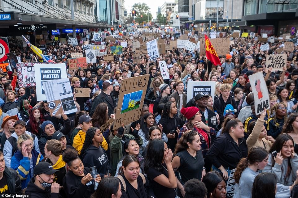 Supporters of the BLM movement in New Zealand listen to speeches during an organised march today following the death of George Floyd in the US