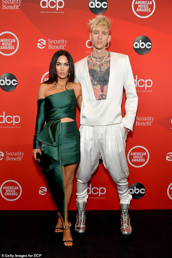 Red carpet debut: Megan and MGK, six-months into their whirlwind romance, made their red carpet debut at the 2020 American Music Awards in Los Angeles, California (pictured)