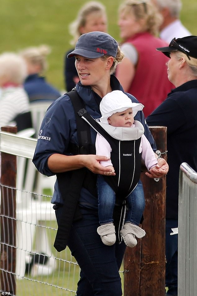 Zara and Mike Tindall's eldest daughter Mia Grace was born on January 17, 2014. Mia was delivered on the NHS at the Gloucestershire Royal Hospital, weighing 7lbs 12oz. Pictured: Zara carrying Mia in 2014