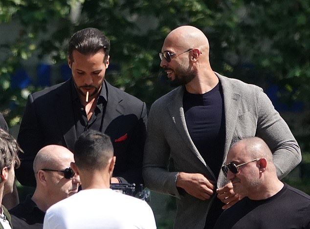 Brothers Tristran (left) and Andrew Tate (right) seemed relaxed as they arrived in court on June 21