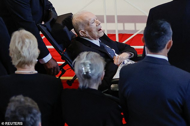 Jimmy Carter died at 100 on Sunday, almost two years after announcing he would spend his final days in hospice care. (Pictured: Jimmy attending his late wife's funeral)