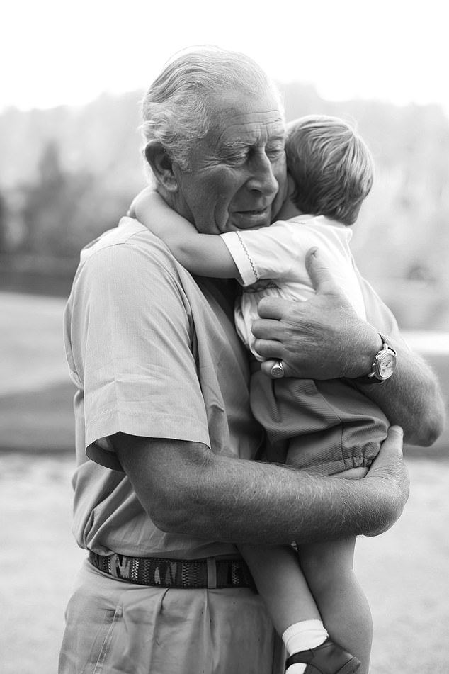 Clarence House wished Prince Louis a happy second birthday with this photo showing hugs from his grandfather