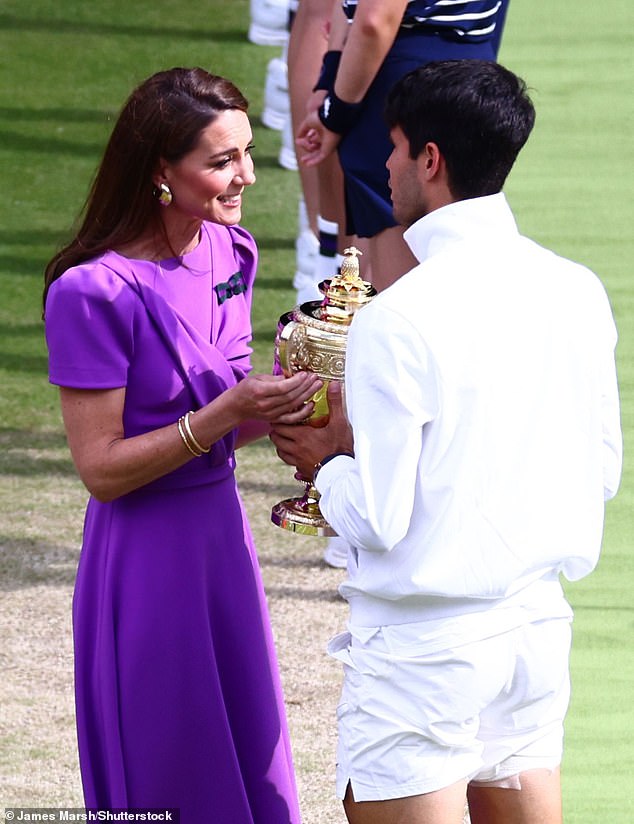 Kate looked delighted to be back in action as she presented the trophy to Alcaraz