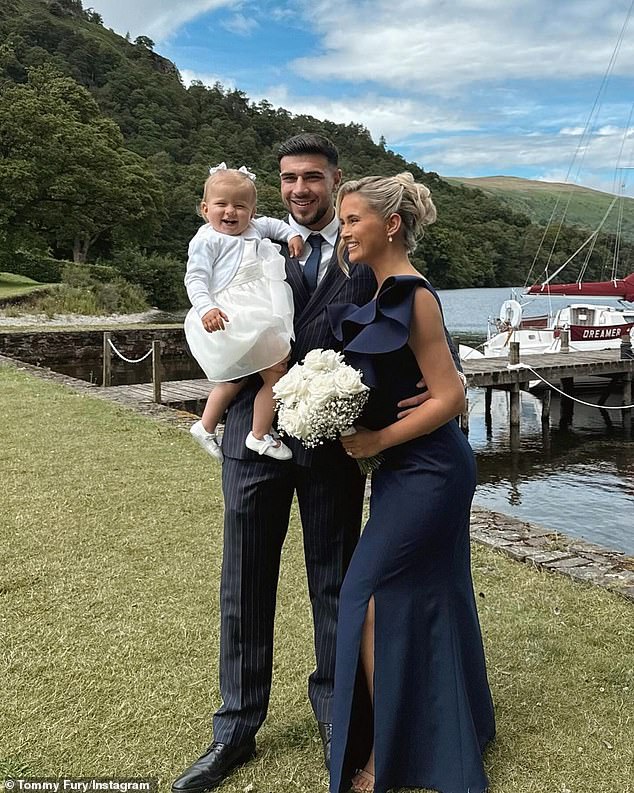 Tommy Fury pictured with Molly-Mae Hague and their daughter Bambi at the wedding of her sister Zoe weeks before the end of their relationship