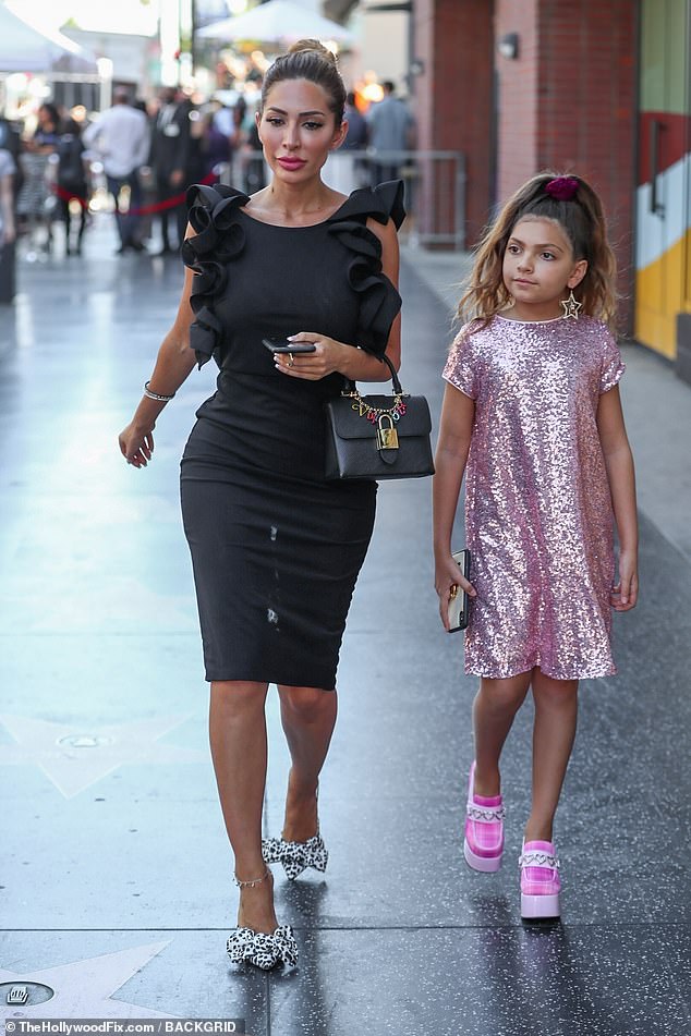 In place of the vibrant colors, tulle skirts and sparkling sequins that Sophia once gravitated toward, she now favors all-black goth-style clothing; pictured with her mother in 2019 in Hollywood