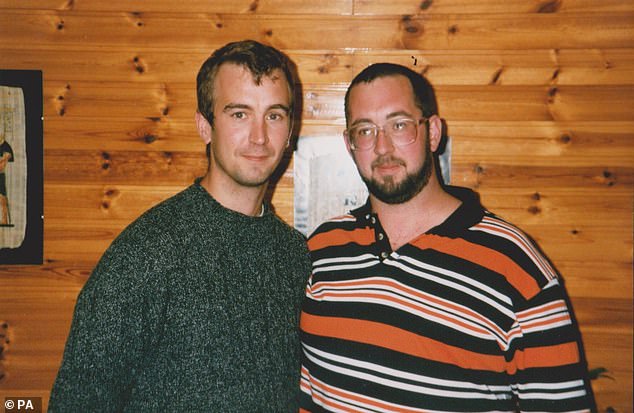 David with his older brother Mike in a photograph taken in the late 1990s. Mike says he has forgiven his brother's killers