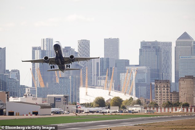 Each traveler is required to have their own ETA to enter the UK, including all children. (pictured: File photo of London City Airport)