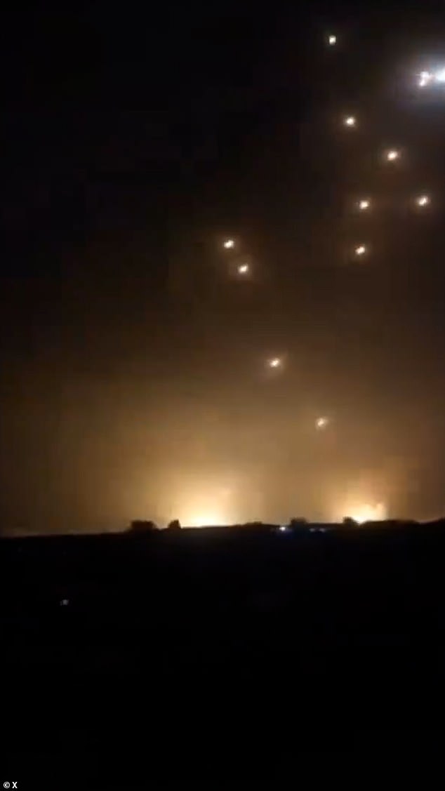 Israel's air defences were pushed to the limit last night, with dramatic video footage showing the moment some Iranian missiles slammed into the ground and exploded