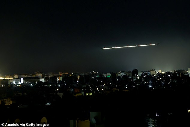 Many rockets, understood to be fired from Israel, are seen over the Dahieh area