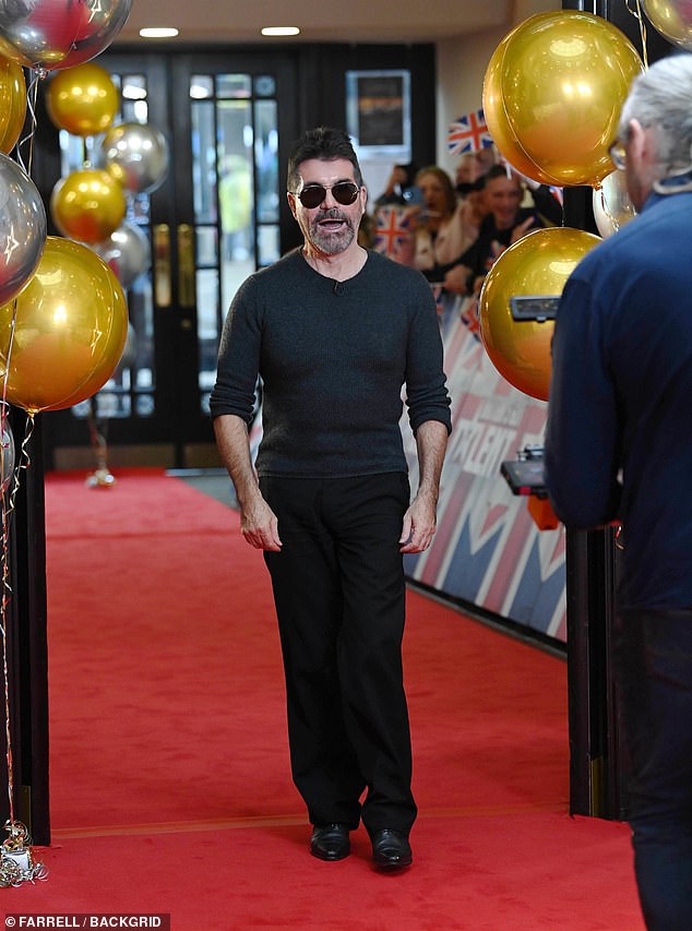 The music mogul sported his usual all-black ensemble, wearing a jumper and trousers with a pair of aviator sunglasses