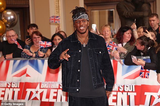 The YouTuber cut a trendy figure on the red carpet in a denim jacket and dark jeans, sporting his signature bandana and flashing peace signs to the crowds