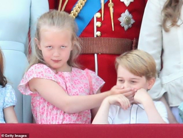 The young royal covering Prince George's on the balcony of Buckingham Palace in 2018