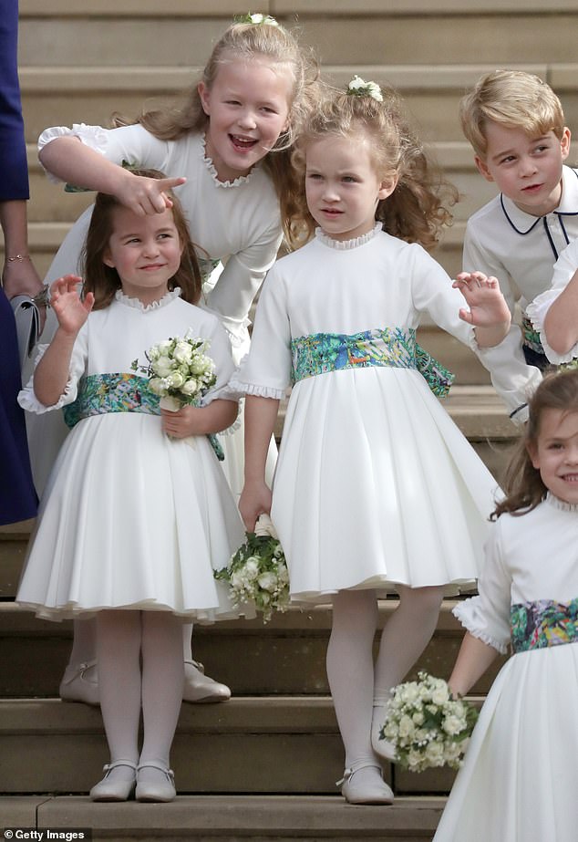 Savannah as a flower girl at Princess Eugenie's wedding in 2018, Prince George and Princess Charlotte can be seen stood nearby their cousin