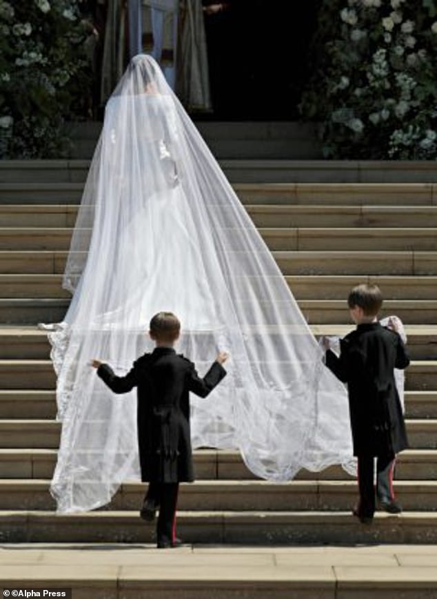 Jessica's twin sons, John and Brian, were page boys and carried Meghan's long veil as she walked up the steps of St George's Chapel