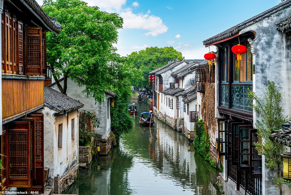 In eastern China lies Suzhou (pictured), an ancient water city that has been described as the 'Venice of the East'. Lonely Planet declares that 'if anywhere truly holds a candle to Venice, it may well be Suzhou', adding that the city is 'all arch bridges and wooden balconies, hanging above trickling, tinkling canals'