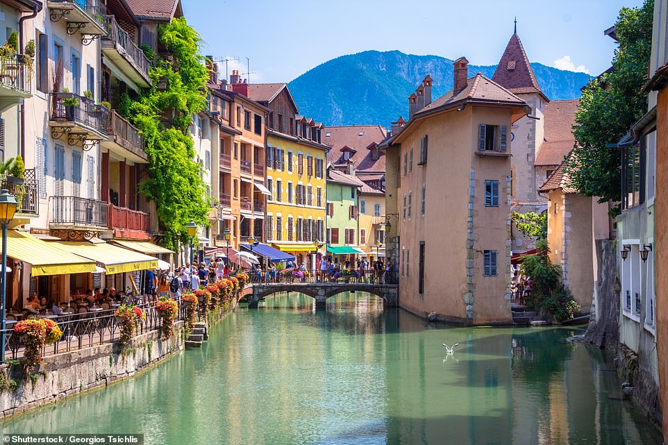 Pictured is Annecy, in southeastern France, a picturesque old city that's built around canals. The city's tourism board says: 'Canals animate the old quarter, bringing it a freshness and life. It is not uncommon to see artists setting up their easels there'