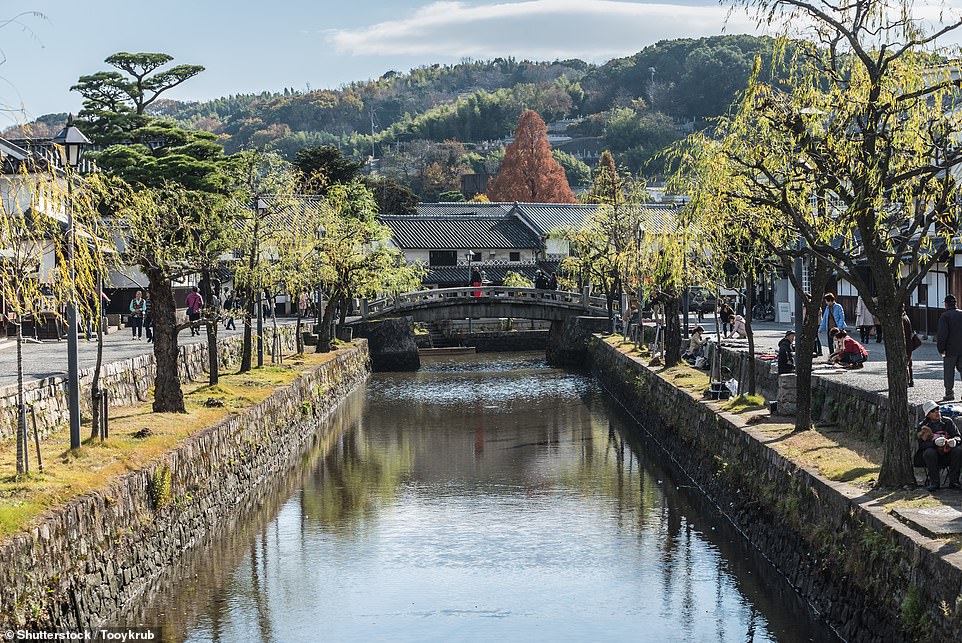 Kurashiki (pictured) is a historic canal city located on Japan's Seto Inland Sea. The Japan National Tourism Organization says: 'Canal-lined, white-washed and stone-tiled, the streets of the Kurashiki Bikan Historical Quarter are quintessentially Japanese'