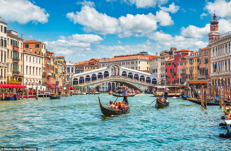 Perhaps the world's most famous canal city, Venice (pictured) is made up of 118 islands floating on a 'fairytale lagoon, linked by 400 bridges', says Lonely Planet. The travel guide recommends visitors of the Italian destination take to the water on a gondola tour or save money with a water taxi