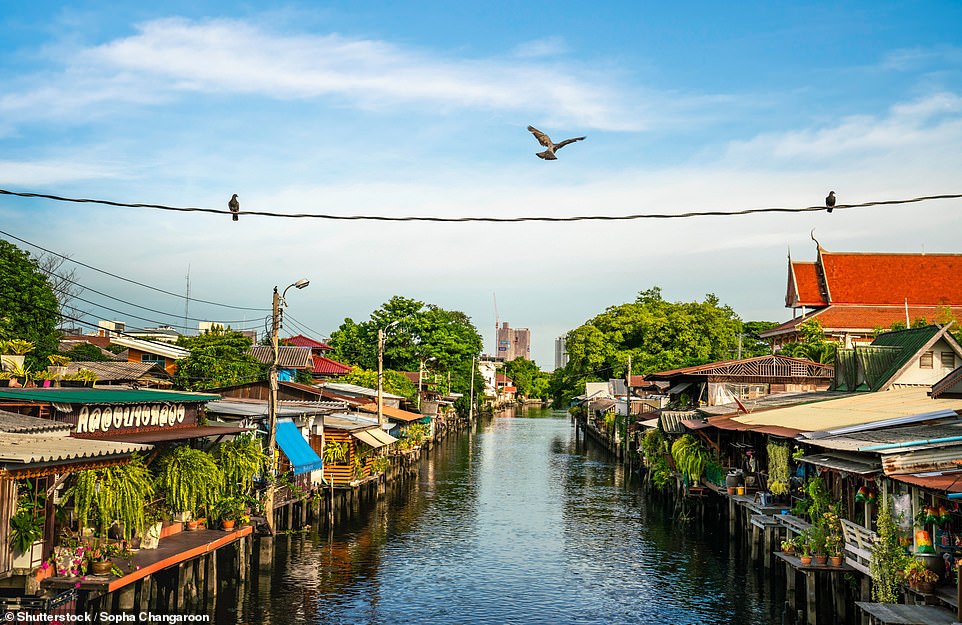 Pictured is Bangkok, Thailand. It has more than 300km/186 miles of waterways, with Lonely Planet describing the city as 'a jade-tinted mosiac of flooded paddy fields, filigreed with the silvery veins of canals'