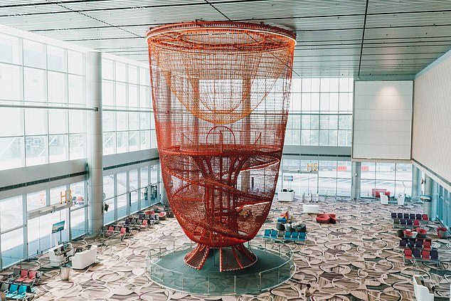 The Chandelier in Terminal 4, a 16- (52-foot) metre-tall play structure with rope courses for passengers to enjoy before their flights. Delfine describes this as a 'standout project'