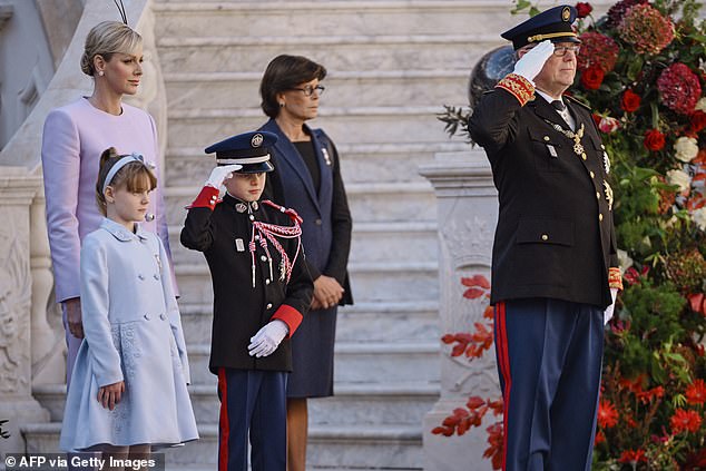 Prince Jacques was every bit his father's mini-me as they both gave a salute