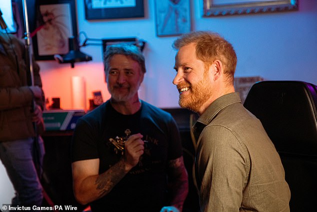 The Duke of Sussex (pictured right) during a 'tattoo' sketch with Jelly Roll (not pictured) at New York tattoo parlour East Side Ink, to promote the 2025 Invictus Games which will be held in Vancouver and Whistler in February