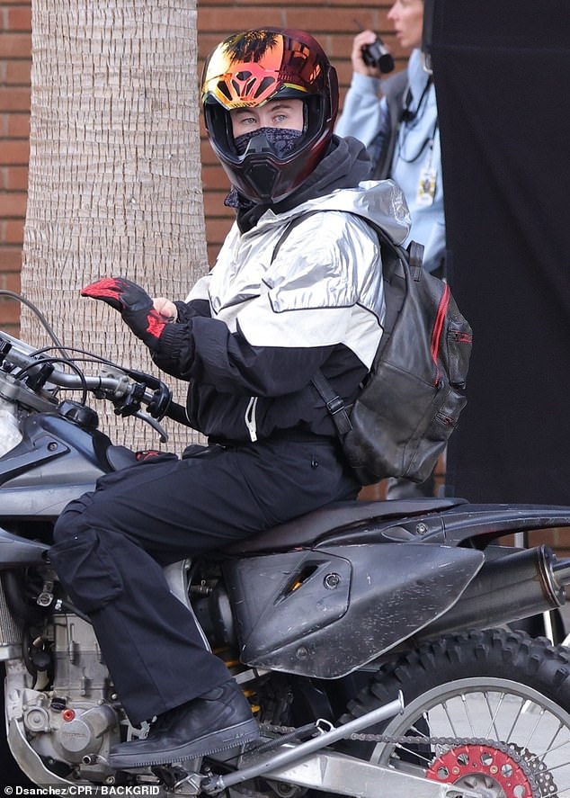 Later on, the Oscar-nominated actor put on an iridescent helmet as he prepared to take off on the bike