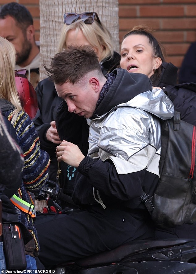 The lower portion of his hair was shaved close to his scalp