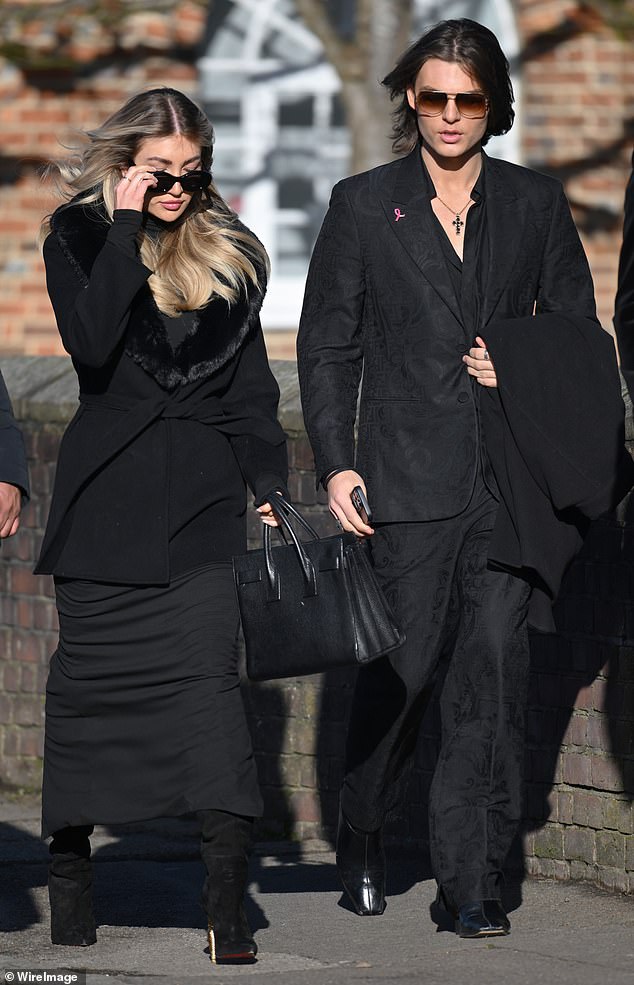 Ms Cassidy (left) was seen arriving at St Mary's Church, dressed in a long black coat with fur trim and wearing sunglasses, alongside Damien Hurley