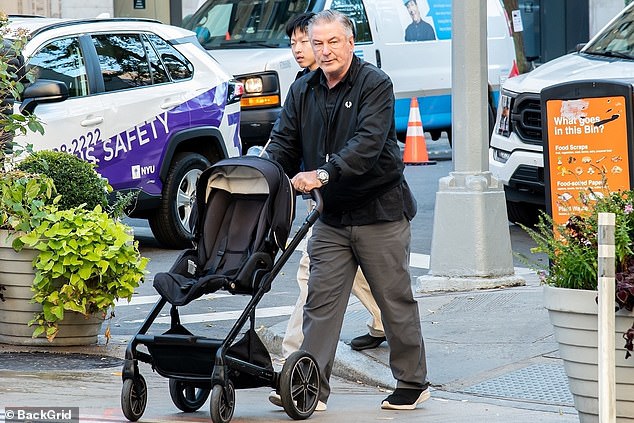 Alec Baldwin, the lead actor and co-producer for Rust, who fatally killed cinematographer Halyna Hutchins on set three years ago, was not in attendance. (Pictured: The actor pushing around a stroller in NYC on Monday)