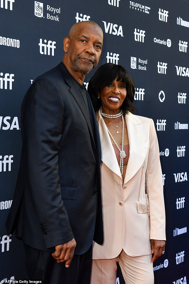 The movie star, 69, spoke to Esquire magazine amid his promotional tour for his new film Gladiator II - explaining that he started drinking two bottles of expensive wine a day after he and his wife Pauletta built a house in 1999 that had a 10,000 bottle wine cellar; Denzel and Pauletta pictured in September at the Toronto International Film Festival