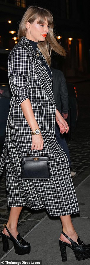 Taylor was decked out in style from head to toe, from her Louis Vuitton Tambour watch to the Gucci footwear