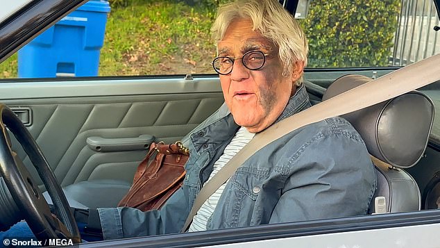 Bruised Jay Leno got back behind the wheel just days after a horror 60ft fall left him with a broken wrist and sporting an eyepatch