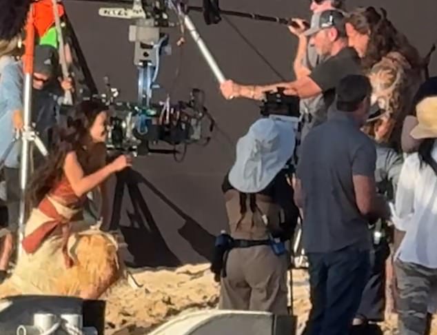 A large black screen was planted on the sand next to the camera as the two stars filmed a scene for the live-action remake - which is slated to hit theaters in July 2026