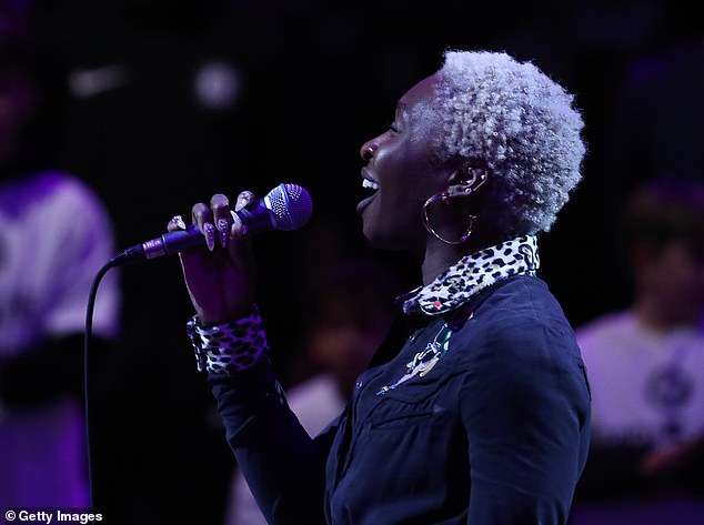 Cynthia stood on the court in agonising silence for 24 seconds as a member of staff whispered the words in her ear during the performance in 201/8 (oictured