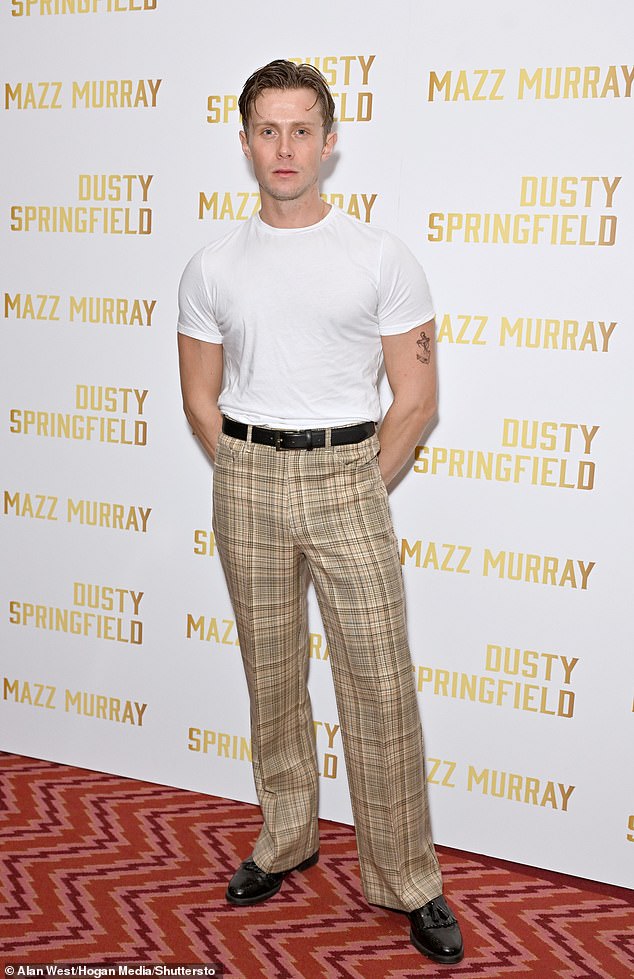 Theatre actor Rob Houchen cut a quirky figure in pale yellow checked trousers and a muscly white T-shirt