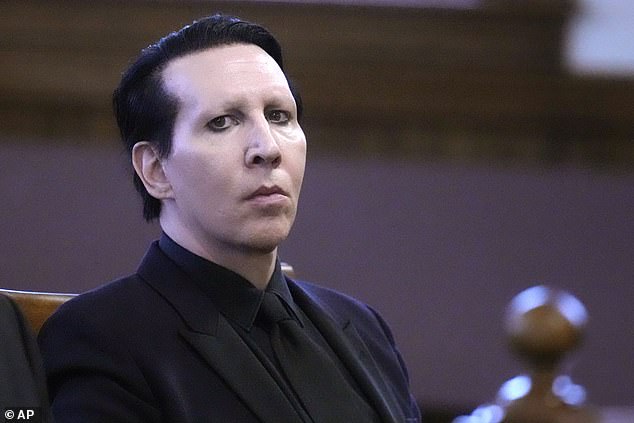 Marilyn Manson, 55, has dropped all ligation against ex-girlfriend Evan Rachel Wood, 37, over allegations of sexual assault she made against him via multiple platforms. Pictured last year in New Hampshire