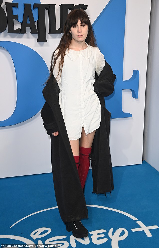 Meanwhile, Dodie Clark put on a leggy display in a white shirt dress and red over-the-knee socks