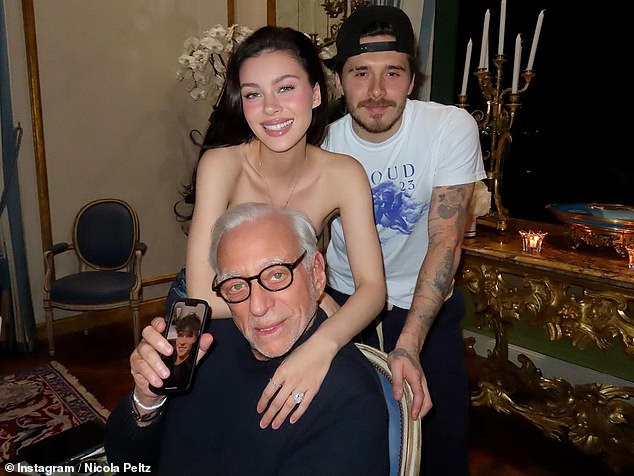 The couple posed with her billionaire businessman father Nelson, who was on FaceTime to her brother Will