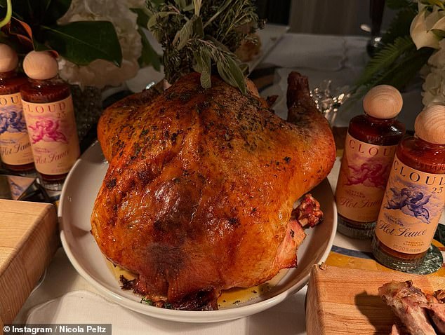 Her parents decked out their opulent dining room table with a turkey, cakes, a charcuterie board, several salads and plenty of side dishes.