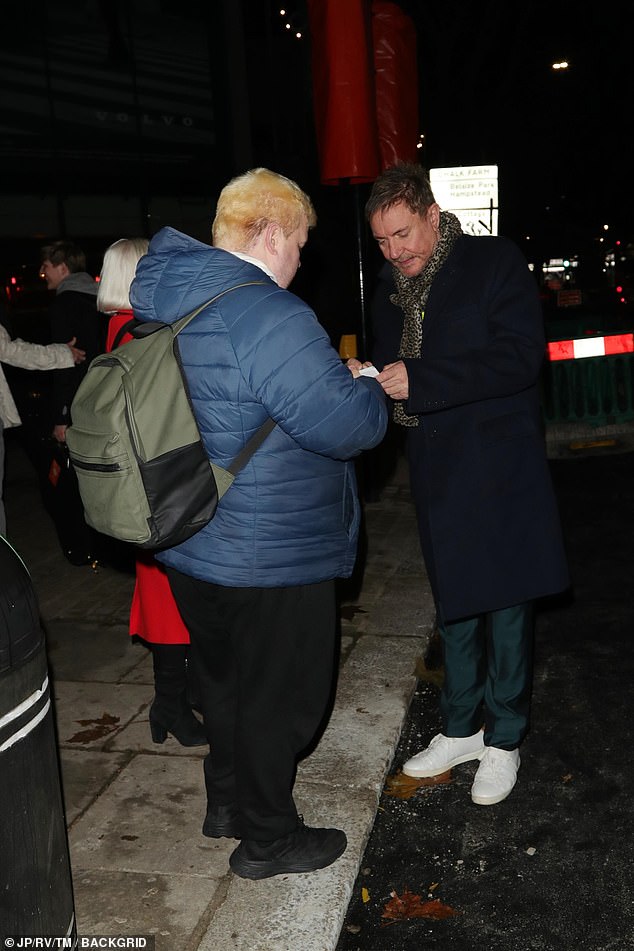 Simon stopped to sign interviews with waiting fans