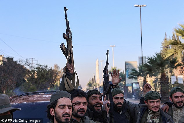 Anti-government fighters celebrate in Aleppo, after jihadists and their allies entered the northern Syrian city