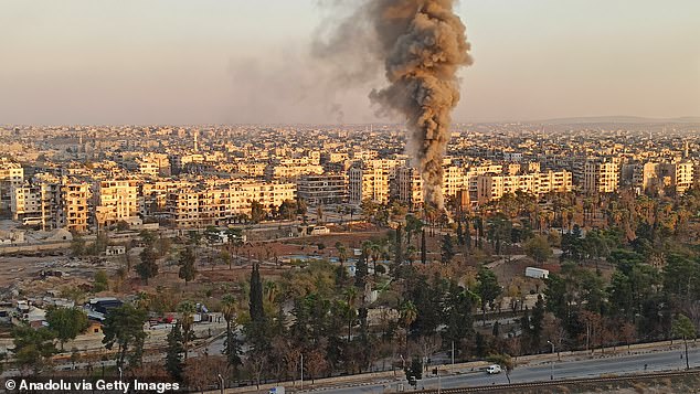 Smoke rises from the area following an airstrike on Aleppo, Syria on November 30