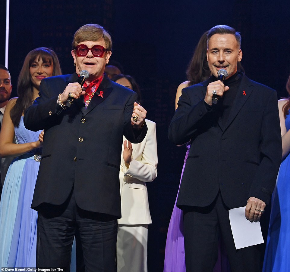 Sir Elton John has confirmed his eyesight has gone after addressing guests at London's Dominion Theatre on Sunday evening, where he was among guests for the red carpet launch of The Devil Wears Prada: The Musical (pictured with husband David Furnish)