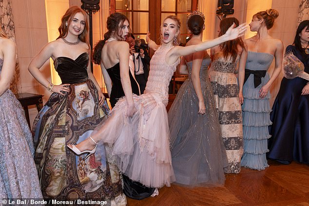 Apple (far right), 20, stunned at the prestigious Le Bal des Débutantes on Saturday, but social media users seem more focused on one of the other women who attended the elite event (far left)