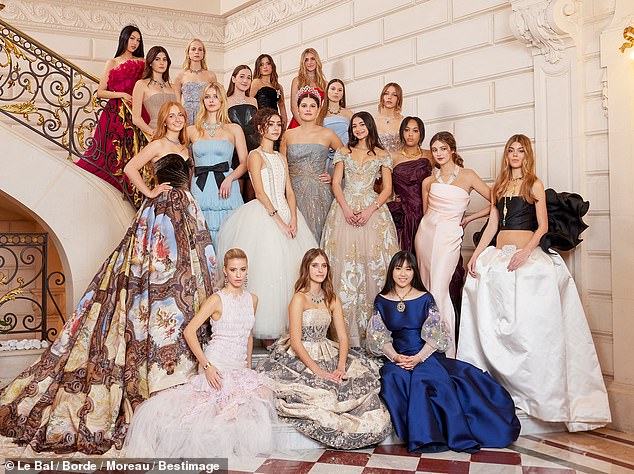 Gwyneth Paltrow and Chris Martin's daughter Apple Martin made her debut into society at a grand debutante ball in Paris on Saturday - but a mystery redhead is now stealing her thunder